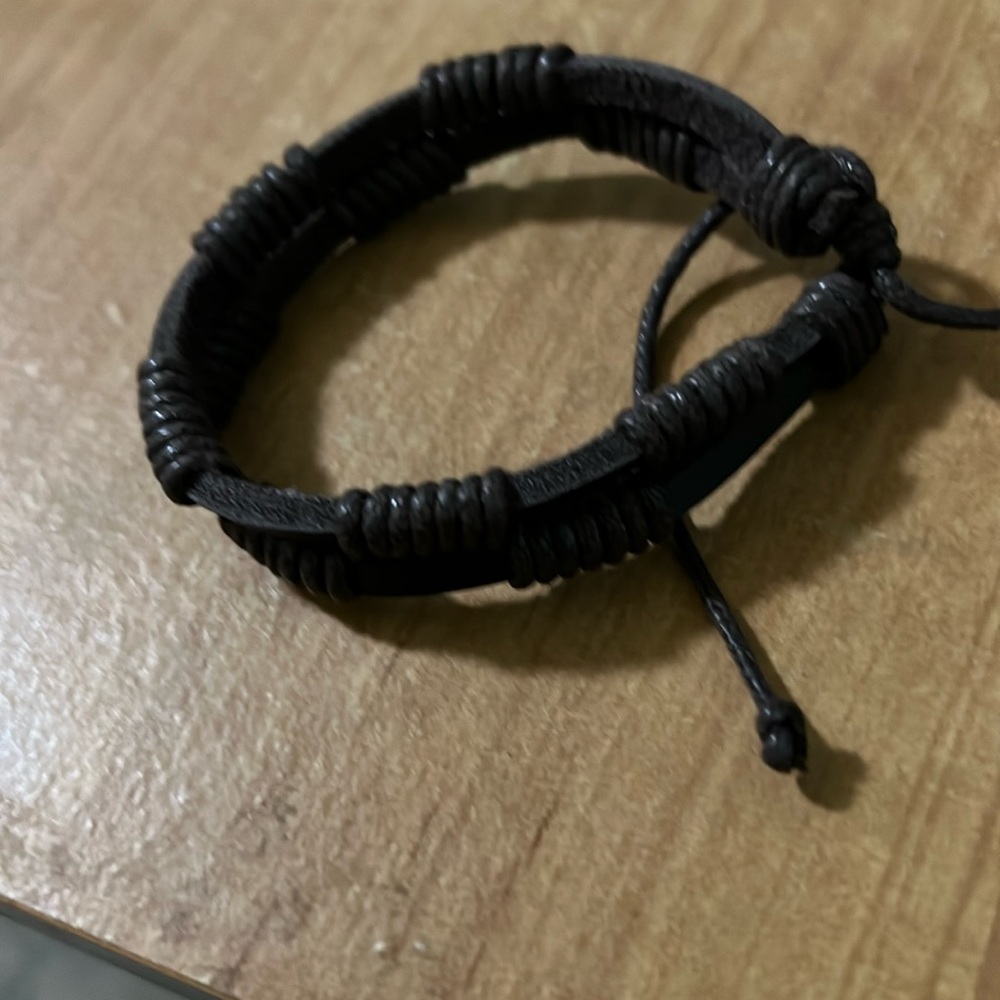 NWOT, Hand woven leather bracelet .